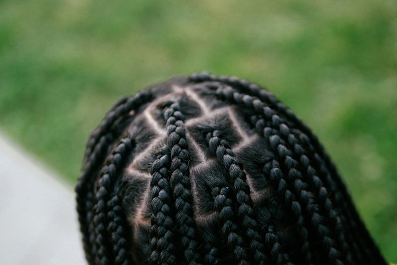 Overhead view of neat cornrows in a geometric pattern